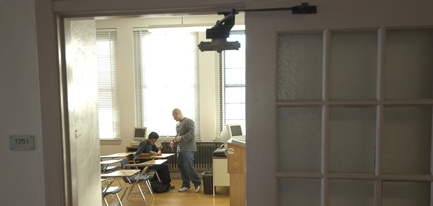 A teacher and student work together in a City Heights school. Photo courtesy of timtadder.com