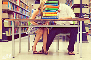 A couple shares a moment in SDSU's Love Library. Photo courtesy of joielala photographie.