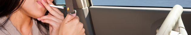 Woman smoking in car