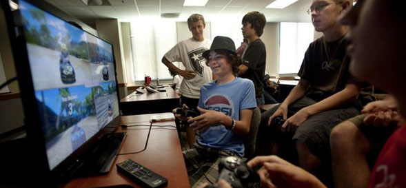 Students testing a video game design created by campers.