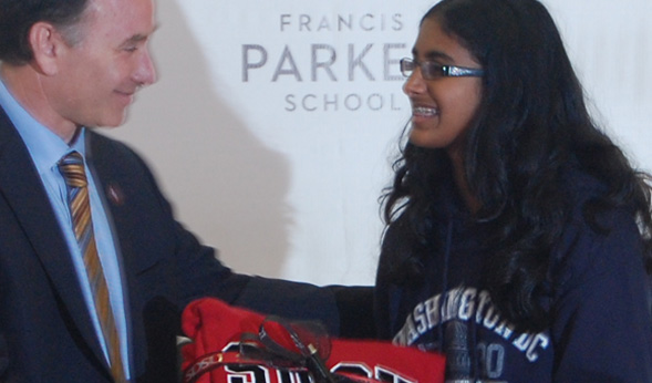 President Hirshman presents Snigda Nandipati with a gift on behalf of the SDSU community.