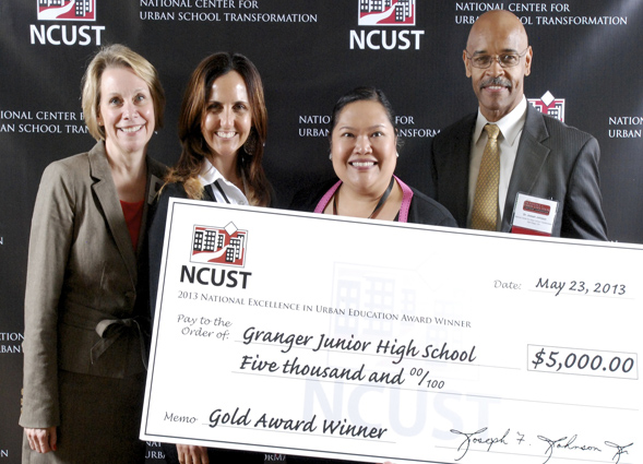 Granger Junior High School accepts a $5,000 check from NCUST and the gold-level award. (Photo Credit: Ray Perez)