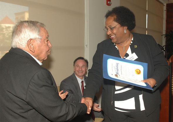 Rodriguez shakes hands with Shirley Weber.