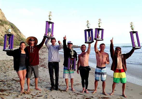 Members of the surf team celebrate their national championship victory.