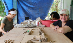 Mayes carrying out analysis in the field lab.