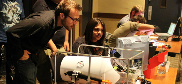 Members of the Mechatronics Club show off the latest prototype.