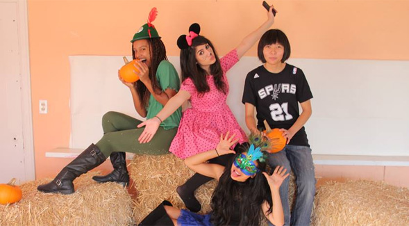 Members of the Child and Family Development Student Organization volunteer at a Halloween carnival.