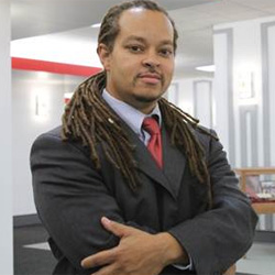 Aaron Bruce in the Love Library next to Donor Hall
