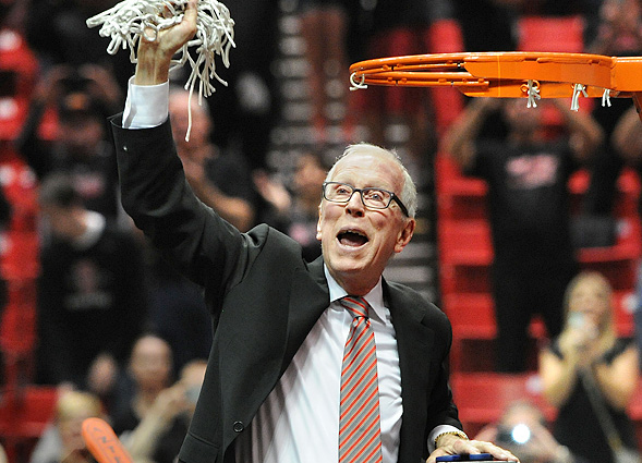 Coach Steve Fisher cuts down the net.