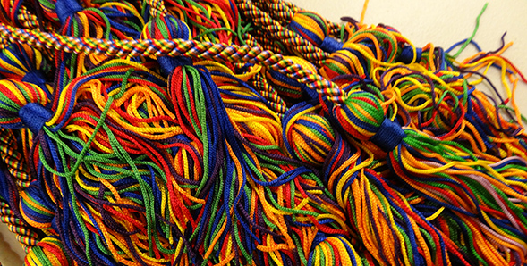 Graduates receive a rainbow cord to wear as part of their commencement regalia.