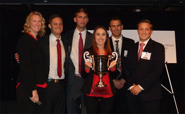 The SDSU team poses with the trophy.