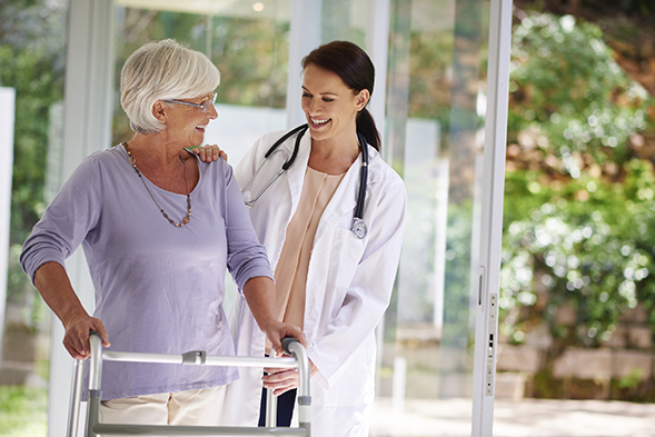 An elderly woman and caretaker.