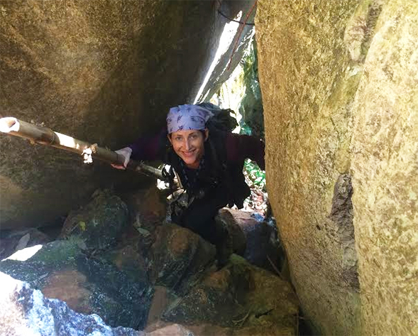 Erin Riley searching for moor macaque monkeys in Indonesia.