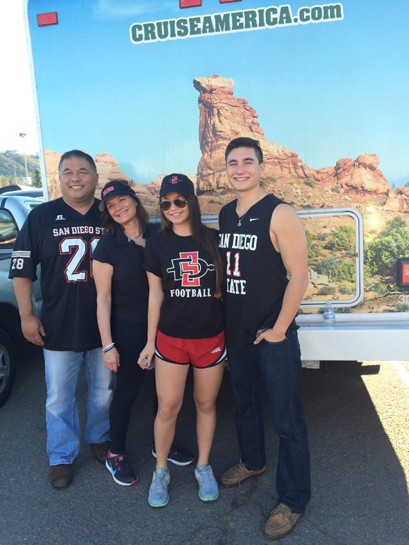 Guy, Francie, Lauren and Max Louie on their way to an Aztec football game.
