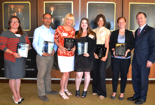 From left: Amanda Etter, Marc Pastor (representing James Frazee), Stephanie Brodine, Brittnie Bloom, Jessica Barlow, Kathy McCarty-Baker and President Elliot Hirshman