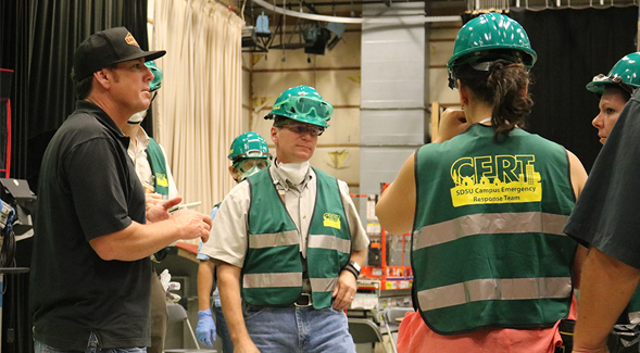 SDSU CERT members discuss procedure during a practice drill.