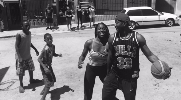 DErryl Williams and McKynzie Fort play basketball with kids in the Domincan Republic.