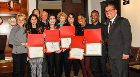 Pam Smith (left), mother of NFL quarterback Alex Smith, along with members of SDSU's Guardian Scholars Program. (Credit: SDSU EOP)