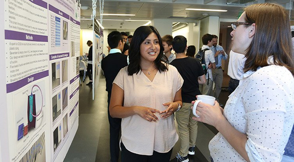 Laura Sandoval presents her research at a conference at the University of Washington. (Credit: Marcus Donner)