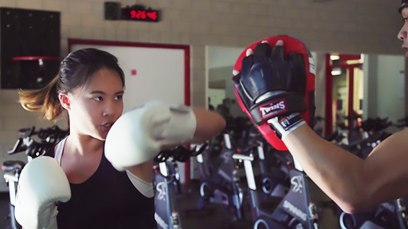 Karyna Yoong kickboxing at the Aztec Recreation Center