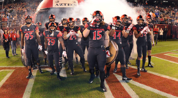 The Aztecs make their entrance to the field. (Photo: Ernie Anderson/GoAztecs)