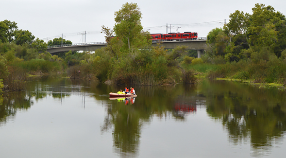 Trent Biggs and colleagues take water samples on the San Diego River in Mission Valley.