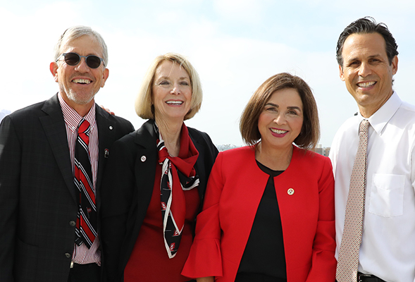 On campus with President Adela de la Torre (third from left) were her husband, Stephen Bartlett; Mary Ruth Carleton, VP for University Relations and Development; and Seth Mallios, SDSU history curator