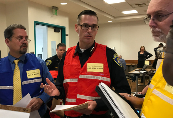 SDSU administrators consulting during the drill are (from left) Eric Hansen, Police Chief Josh Mays, Robert Schulz