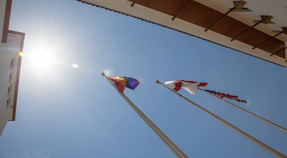 Image shows pride flag during annual pride flag raising ceremony in 2018.