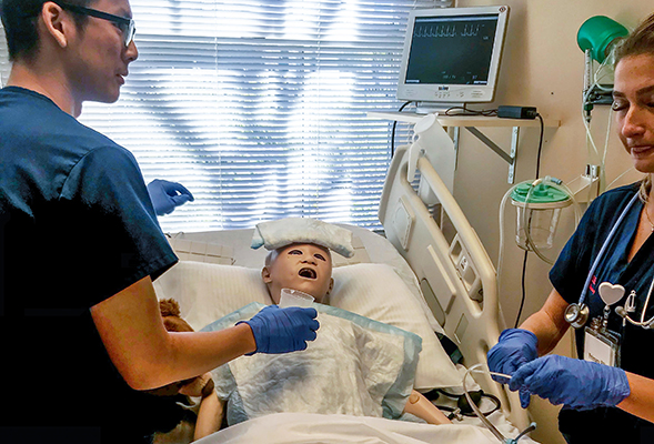 SDSU nursing students, shown here with a patient mannequin, are trained under a Quality and Safety Education for Nurses program.