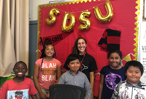 Aimee Islas (center) with students (from left) Jamari, Kayla, Carlos, Saniyah and Andy at Taylor Leadership Academy.