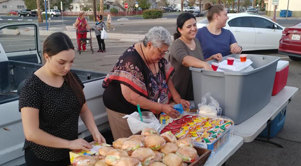 SDSU Imperial Valley student affairs advisor Norma Aguilar (center) and students Tiffani Escalante, Viviann Cesea and Ana Fernanda Lizarraga volunteering at meal service. Photo: Maribel Padilla