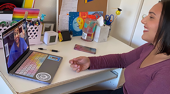 Community-Based Block graduate student Lucy Plascencia (right) speaks to fellow CBB graduate student Nathan Klein via teleconferencing.