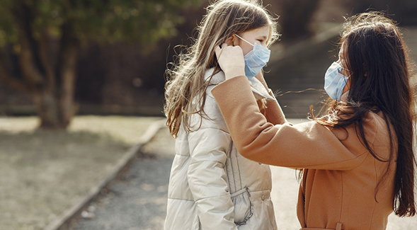 Parent and child wearing facial coverings