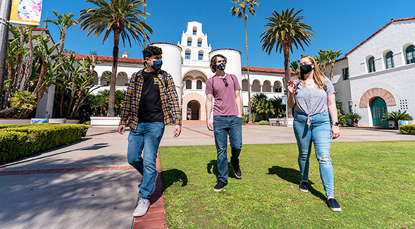 Students wearing masks in front of Hepner Hall