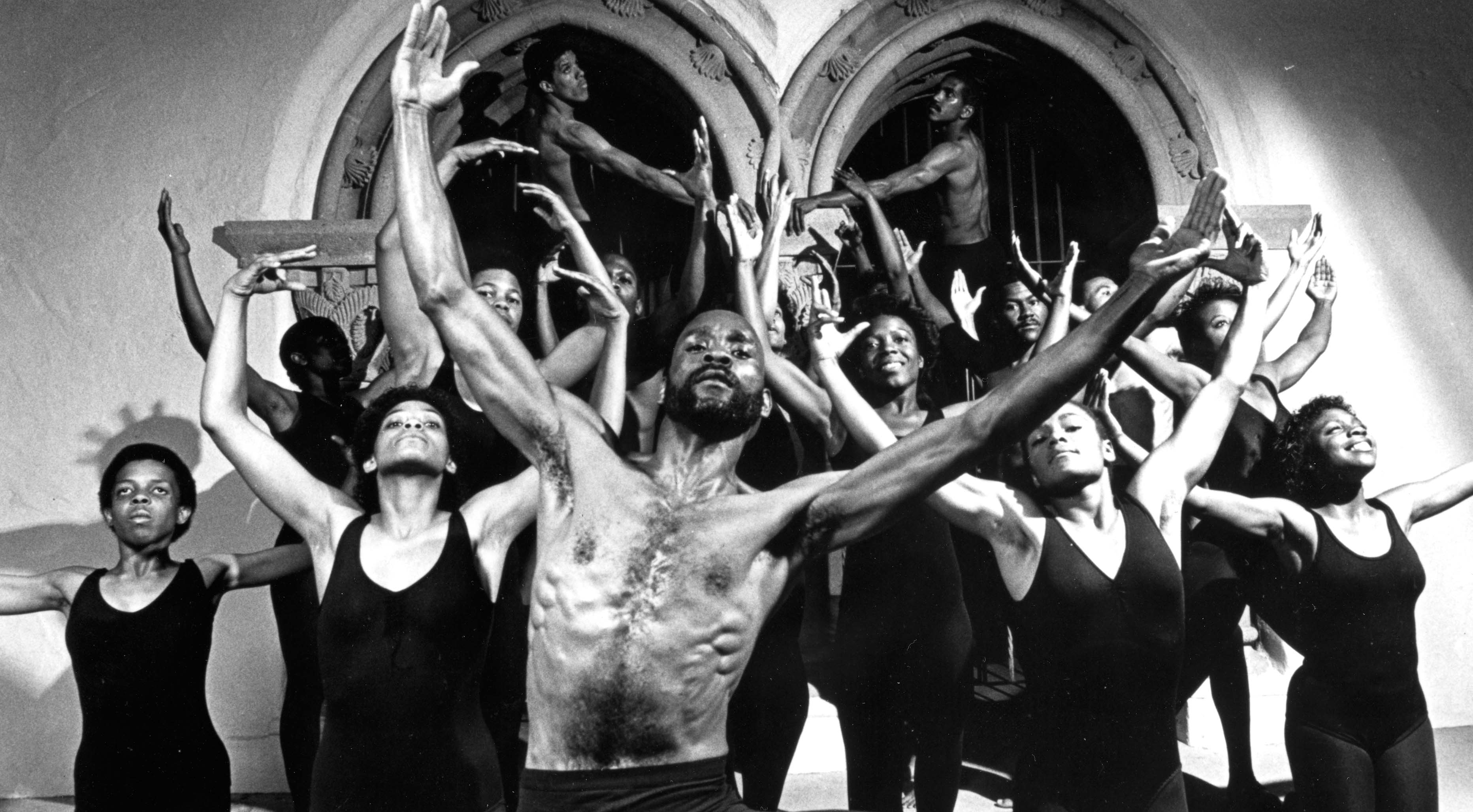 Members of the Black Repertory Total Theatrical Experience stand in dance postures on campus. (Photo: University Archives Photograph Collection, University Library)