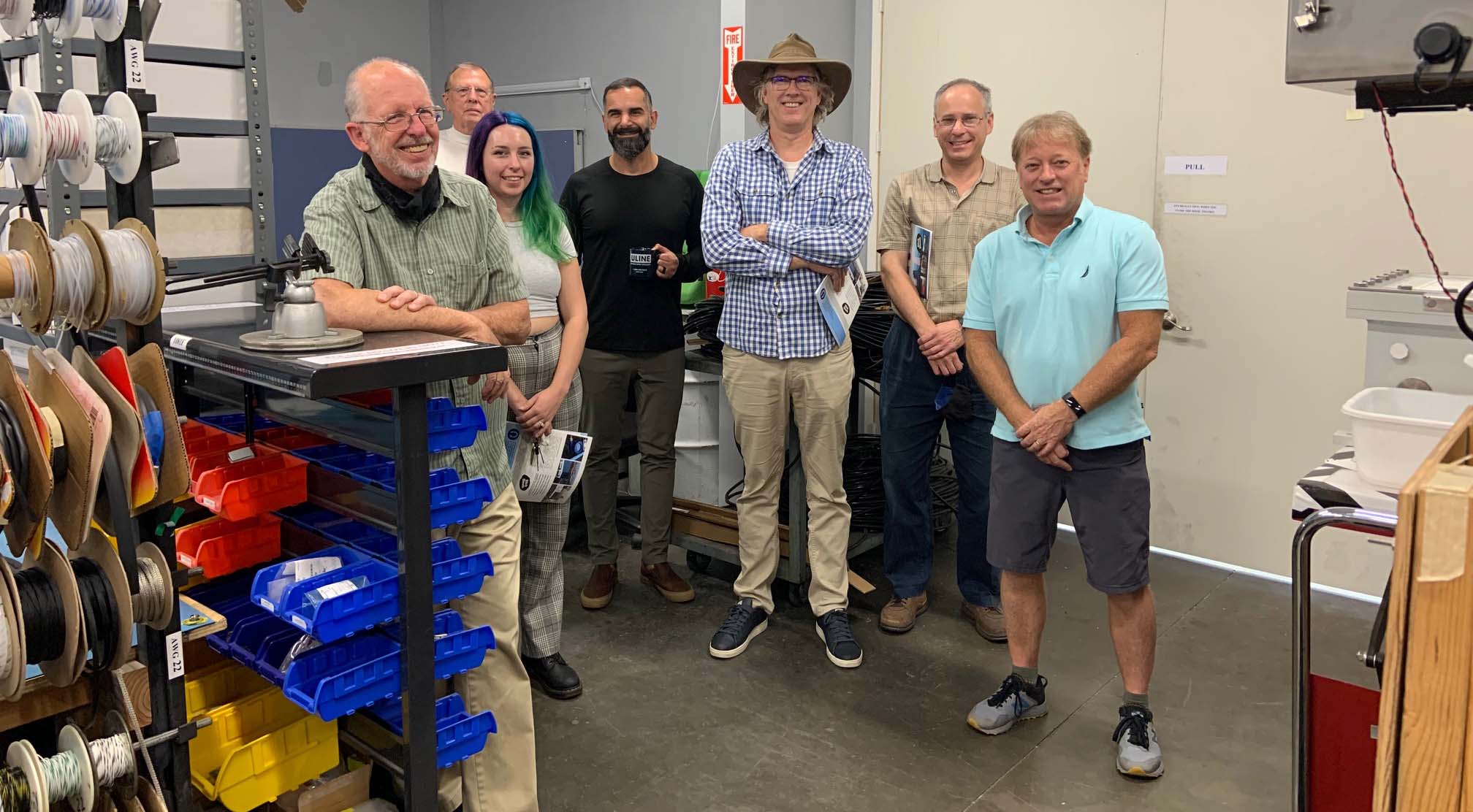 Chemistry professor Dave Pullman and physics professor Matt Anderson (second and third from right, respectively) lead a team developing sensors to detect oil spills. (See footnote for additional IDs)