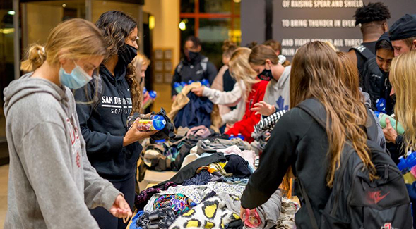 As part of the Aztecs Going Pro program, SDSU student-athletes donated and sorted clothing for those in need.