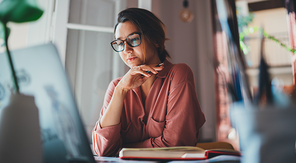 Winter session courses at SDSU are conducted online. (Image of student with computer)