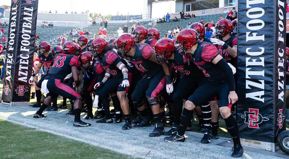 The football team is seen here on the sidelines during a game against Boise State.