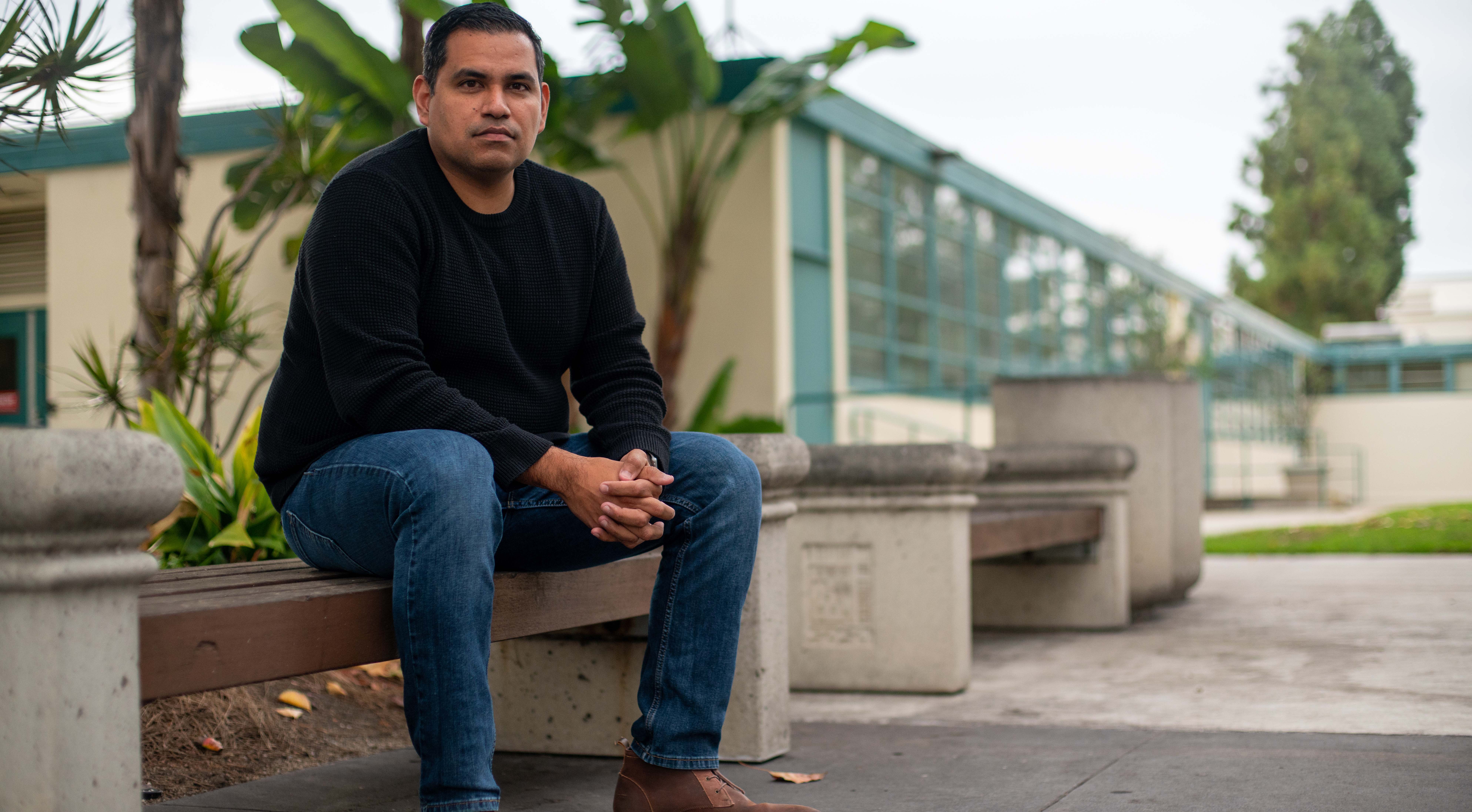 Eric Felix, seated outside the Education building at SDSU. (Photo: Ian Ordonio)