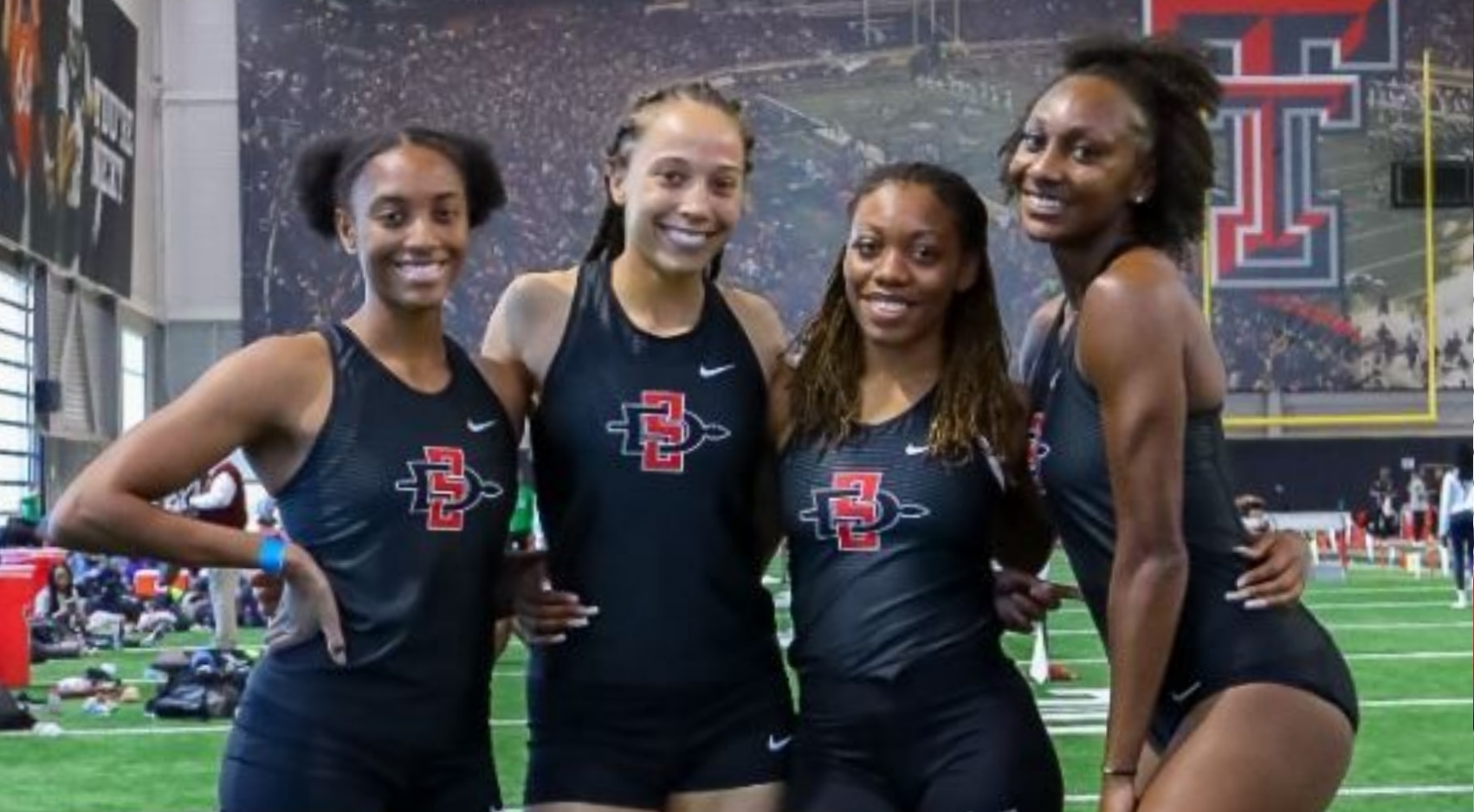 SDSU track and field women's 4x400m relay team members, from left, Nyjari McNeil, Sakura Roberson, Rhea Hoyte, and Jalyn Harris pose during the Texas Tech Open in Lubbock, Texas. (Photo: GoAztecs)