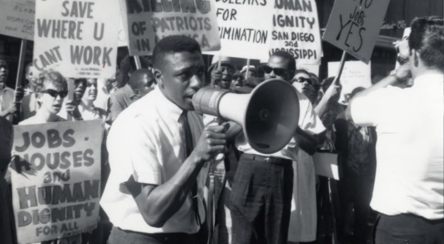 Hal Brown (with megaphone) was a leader in helping to integrate residential neighborhoods in San Diego County in the early 1960s.