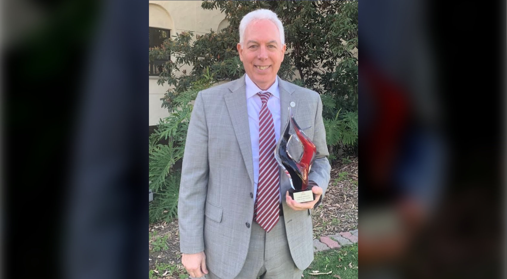 Steven Hooker, SDSU CHHS Dean, with his 2021 Presidential Leadership Aztec Achievement Award.