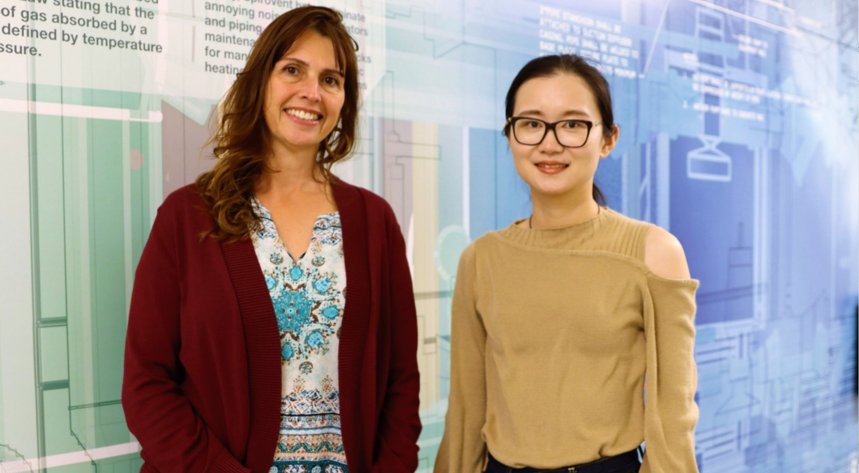 Natalie Mladenov (left) and Junfei Xie (right) pose in the Clark Construction Innovation Pathway of the Engineering and Interdisciplinary Sciences (EIS) Building.