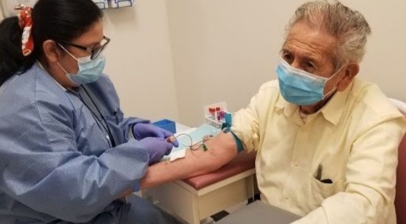 Drawing blood from a study participant at the South Bay Latino Research Center. Photo by South Bay Latino Research Center.