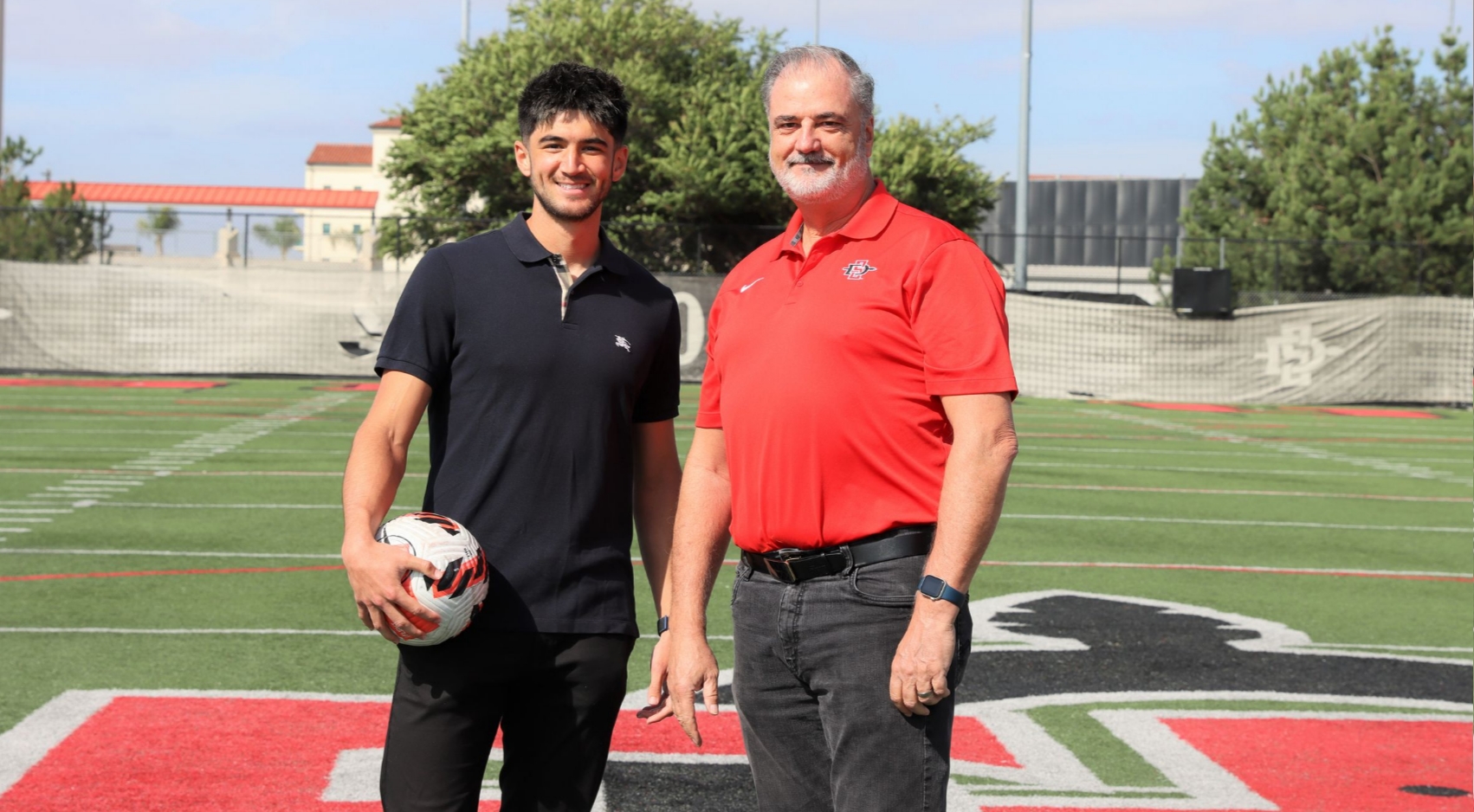 SDSU junior Kyle Colonna with alum Steve Doyle (80).