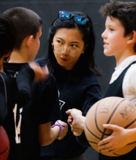 Coach Mary-Elizabeth Pacio mentoring youth basketball players. (Photo by Isaiah Paguio)