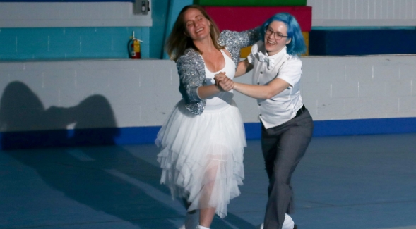 SDSU professor Amanda Marino (left) and wife Emily skating as a couple.
