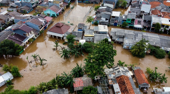 Aerial POV view Depiction of flooding devastation wrought after massive natural disasters at Bekasi, Indonesia.